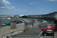 This is the classic view of the Carlisle Pier as it was in 2002, with the trainshed and 1950s built buildings to the right. The tarmac ground where the cars are mark the site of the filled in platforms.